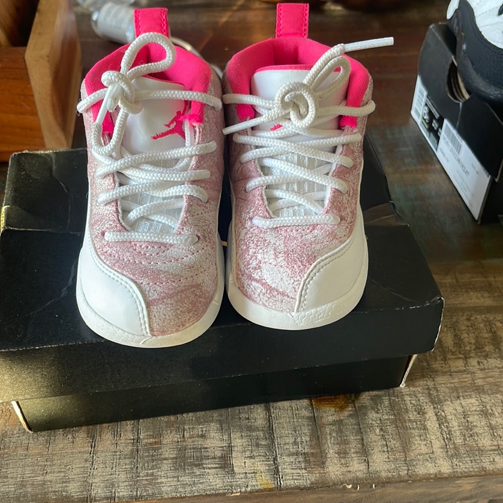 Kids pink and white Jordans